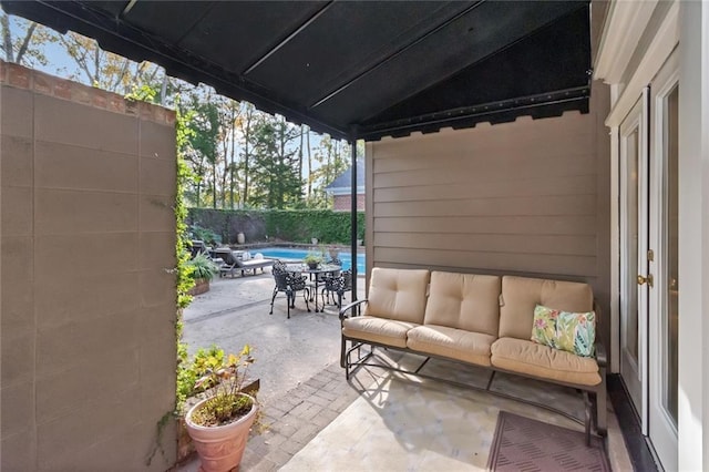 view of patio featuring a fenced in pool and fence