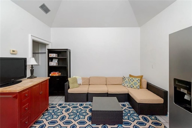 living room with visible vents and vaulted ceiling