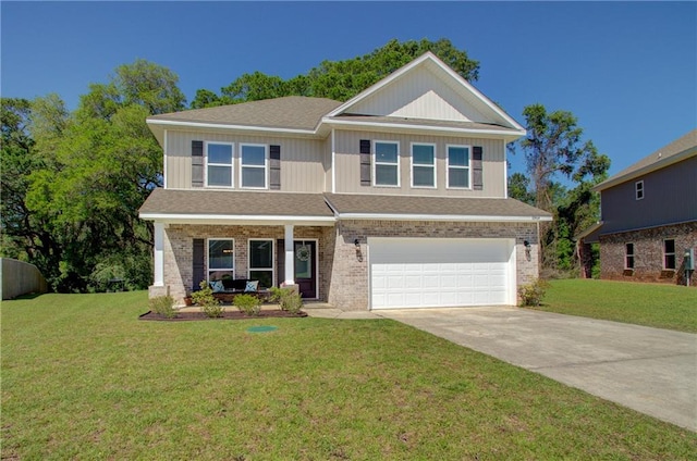 view of front of property featuring a front yard and a garage