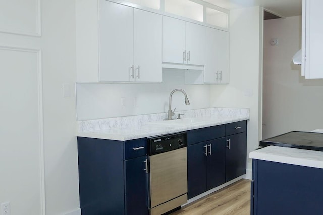 871 Hale Rd, Mobile, AL 36608 - kitchen with dishwasher, a sink, light countertops, light wood-type flooring, and white cabinets