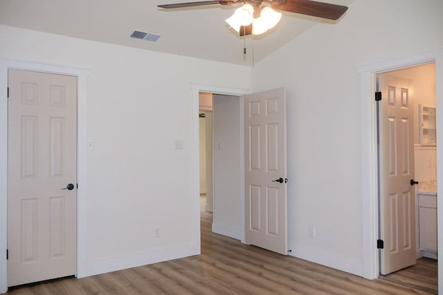871 Hale Rd, Mobile, AL 36608 - unfurnished bedroom featuring wood finished floors, baseboards, ensuite bathroom, and a ceiling fan