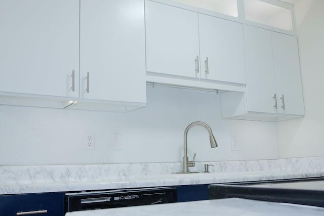 871 Hale Rd, Mobile, AL 36608 - kitchen featuring dishwashing machine and white cabinets