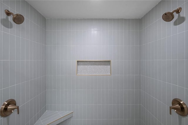 bathroom with a tile shower