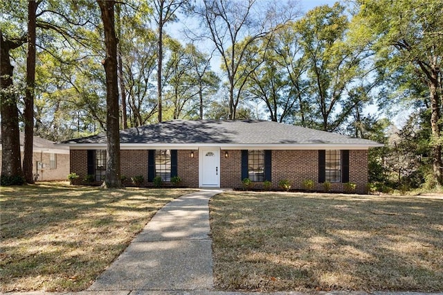 ranch-style home with brick siding and a front yard