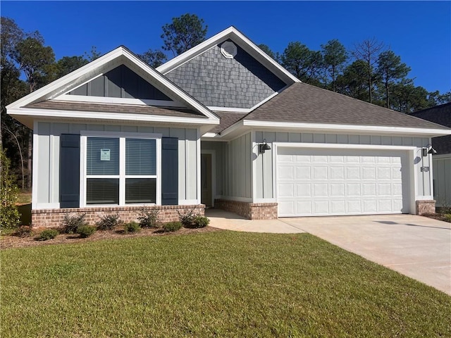 craftsman house with a front lawn and a garage