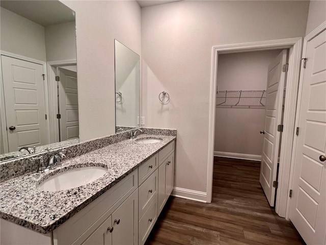 bathroom with hardwood / wood-style floors and vanity