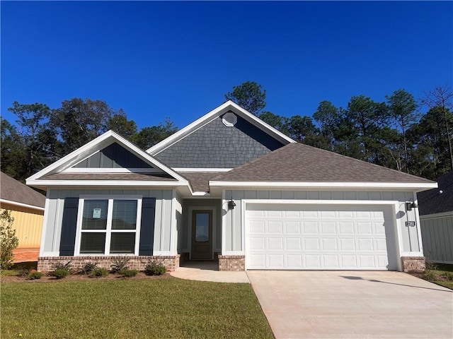 craftsman-style home with a garage and a front lawn