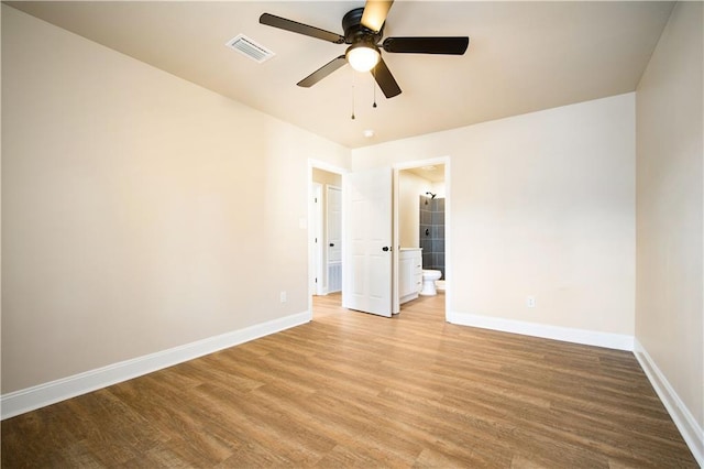 unfurnished room featuring visible vents, baseboards, a ceiling fan, and light wood finished floors