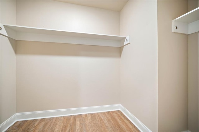 spacious closet with wood finished floors