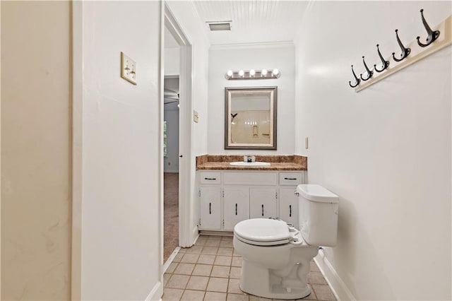 bathroom with vanity, tile patterned floors, and toilet