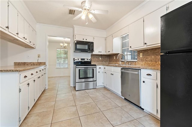 kitchen featuring crown molding, white cabinets, and black appliances