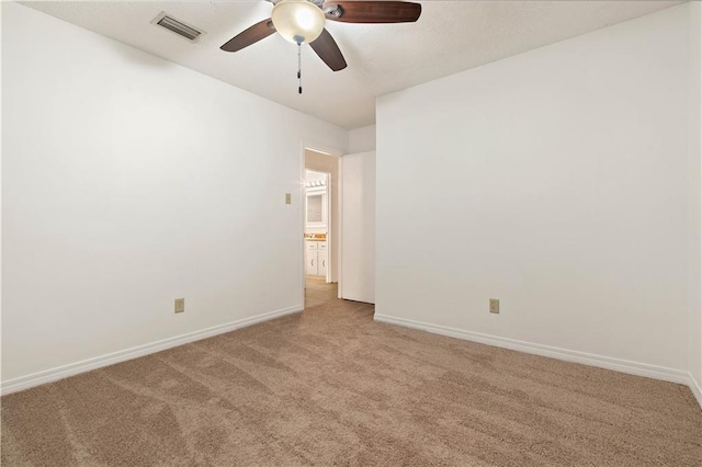 empty room with carpet floors and ceiling fan