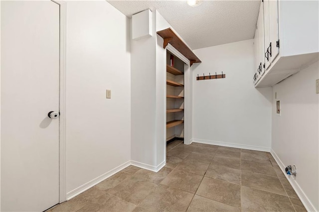 walk in closet featuring light tile patterned flooring