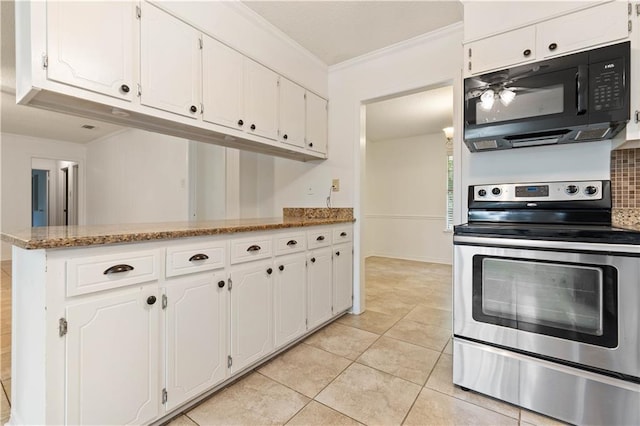 kitchen featuring white cabinets, ornamental molding, light tile patterned floors, light stone countertops, and electric stove