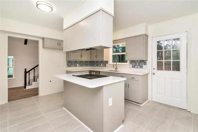 9636 Hamilton Creek Dr S, Mobile, AL 36695 - kitchen featuring gray cabinetry, black electric stovetop, light tile patterned floors, and light countertops