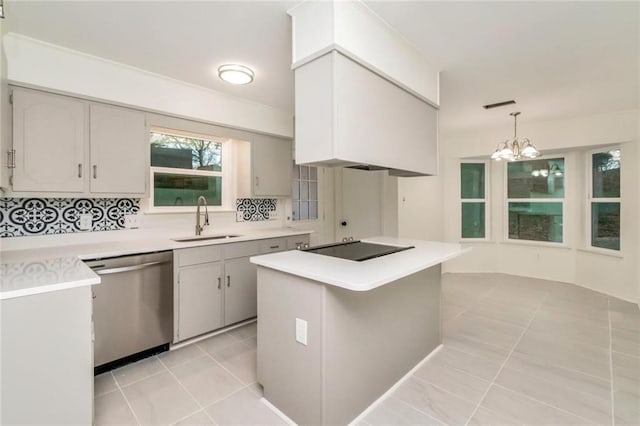 9636 Hamilton Creek Dr S, Mobile, AL 36695 - kitchen featuring stainless steel dishwasher, light tile patterned flooring, black electric cooktop, light countertops, and a chandelier