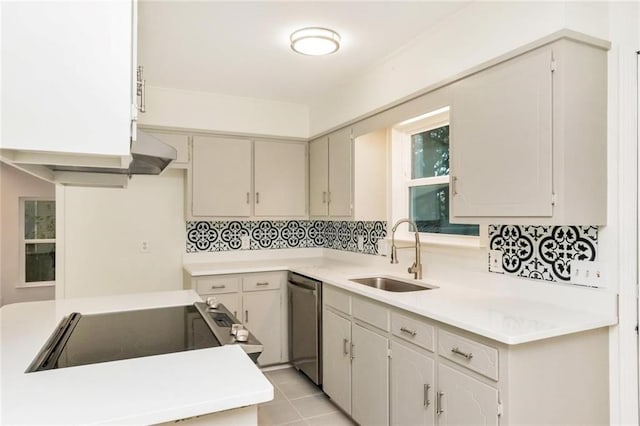 9636 Hamilton Creek Dr S, Mobile, AL 36695 - kitchen with stainless steel dishwasher, range with electric stovetop, light countertops, and light tile patterned floors