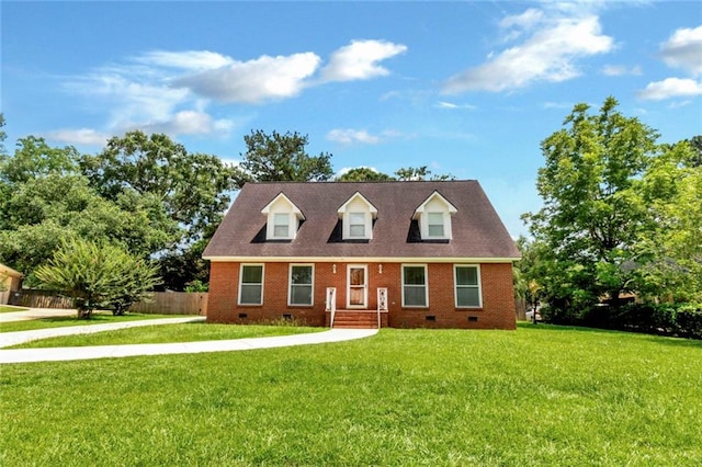 cape cod house with a front lawn