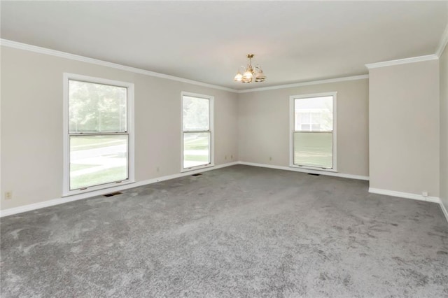 carpeted empty room with a notable chandelier and crown molding