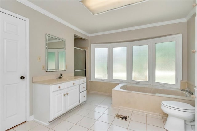 bathroom with a tub, plenty of natural light, tile flooring, and vanity