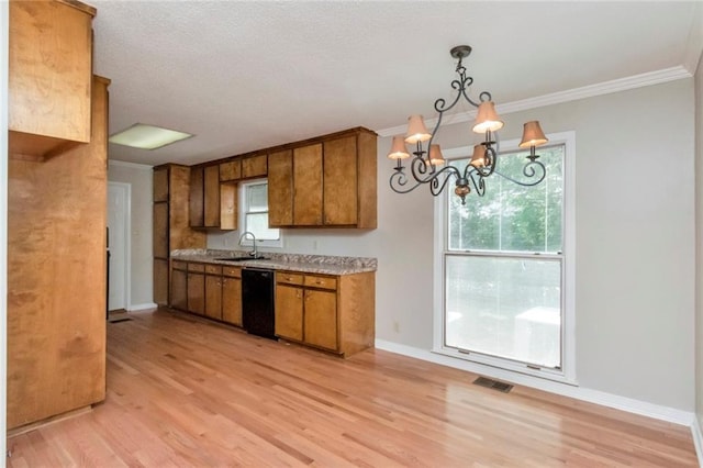 kitchen featuring decorative light fixtures, light wood-type flooring, and black dishwasher