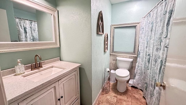 6980 Charmingdale Dr S, Mobile, AL 36618 - full bathroom with a textured wall, toilet, tile patterned flooring, and vanity