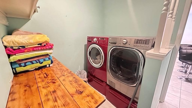 6980 Charmingdale Dr S, Mobile, AL 36618 - clothes washing area featuring independent washer and dryer and light tile patterned floors