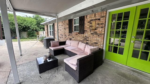 6980 Charmingdale Dr S, Mobile, AL 36618 - view of patio featuring french doors, central AC unit, an outdoor living space, and fence