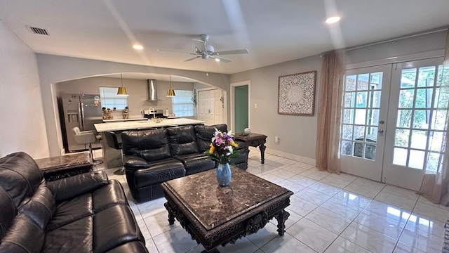 6980 Charmingdale Dr S, Mobile, AL 36618 - living room featuring arched walkways, a ceiling fan, french doors, light marble finish flooring, and recessed lighting