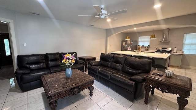 6980 Charmingdale Dr S, Mobile, AL 36618 - living area with a ceiling fan, arched walkways, and light tile patterned flooring