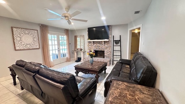 6980 Charmingdale Dr S, Mobile, AL 36618 - tiled living area with a ceiling fan, french doors, a brick fireplace, and baseboards