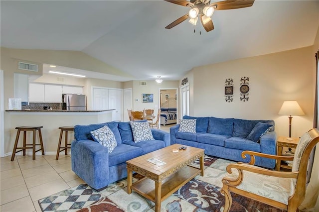 6194 State Highway 59 Unit D-8, Gulf Shores, AL 36542 - living room featuring a ceiling fan, lofted ceiling, light tile patterned flooring, and baseboards