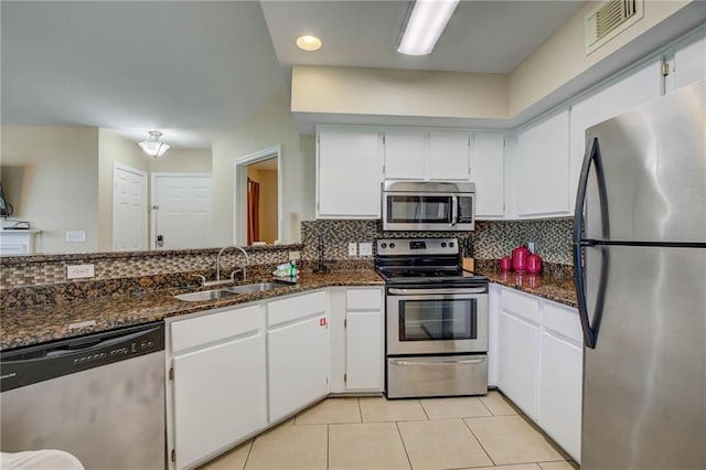 6194 State Highway 59 Unit D-8, Gulf Shores, AL 36542 - kitchen featuring stainless steel appliances, a sink, white cabinetry, and recessed lighting