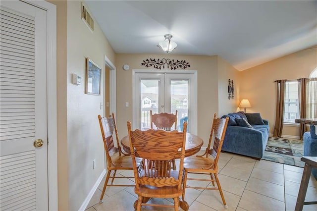 6194 State Highway 59 Unit D-8, Gulf Shores, AL 36542 - dining room featuring french doors, light tile patterned floors, and baseboards