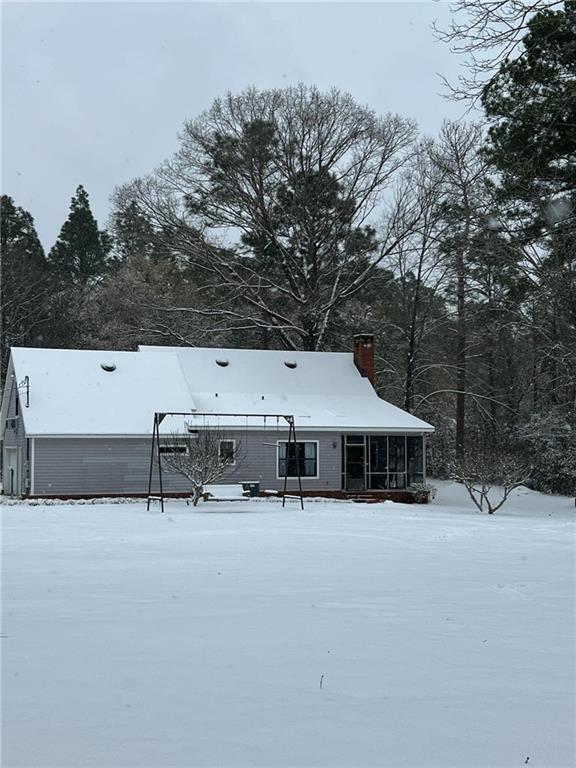 view of snow covered property