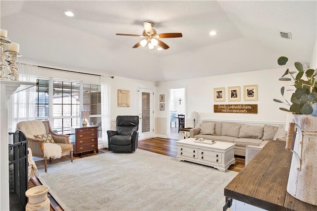 living area featuring visible vents, recessed lighting, lofted ceiling, and wood finished floors