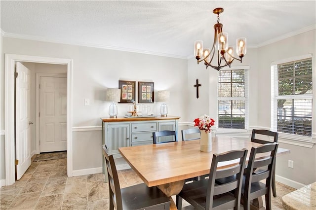 dining area featuring baseboards, an inviting chandelier, and crown molding