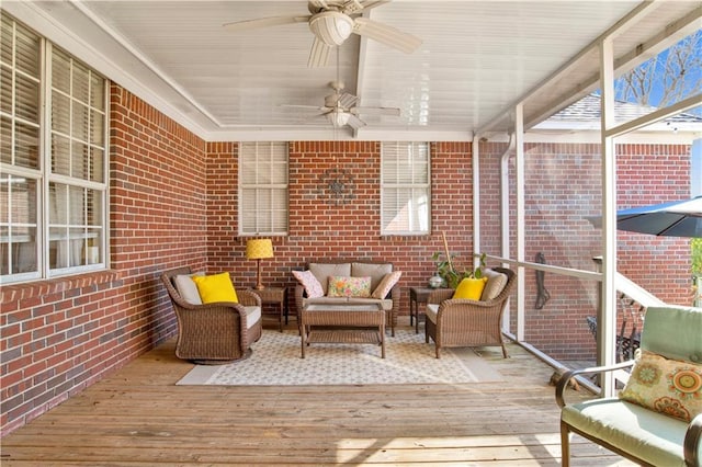 sunroom / solarium with a ceiling fan