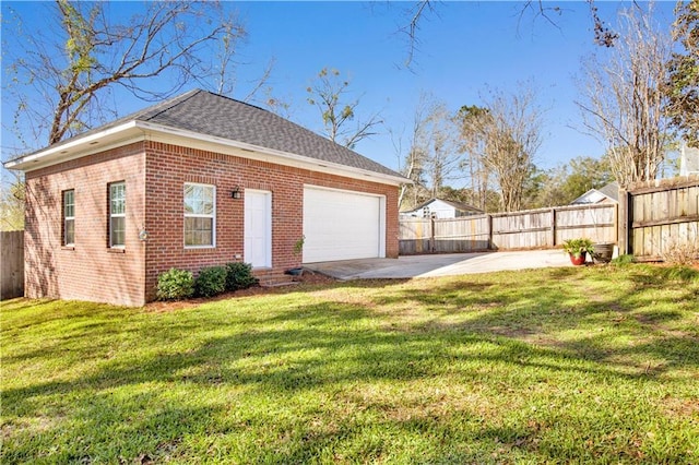 exterior space featuring concrete driveway and fence