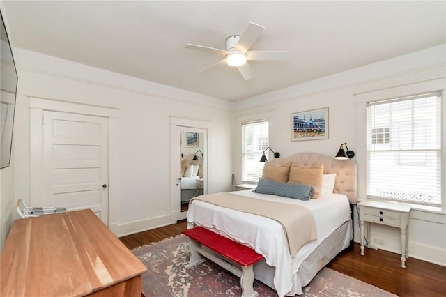 bedroom featuring a ceiling fan, dark wood-type flooring, and baseboards