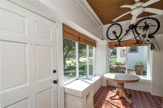 sunroom with a ceiling fan