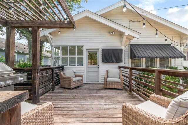 wooden terrace with a grill