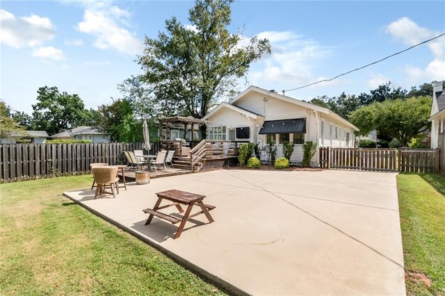 view of patio with fence, a deck, and a pergola