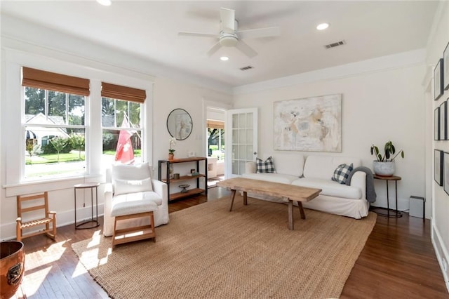 living area with recessed lighting, visible vents, wood finished floors, and a ceiling fan