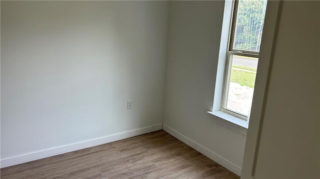 unfurnished room featuring light wood-type flooring