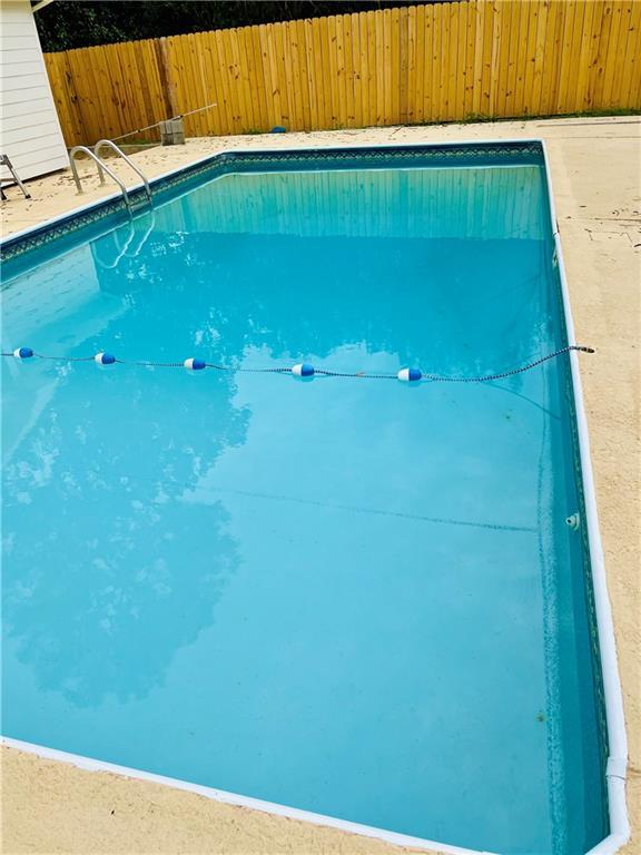 501 Huntleigh Way, Mobile, AL 36608 - view of swimming pool featuring fence and a fenced in pool