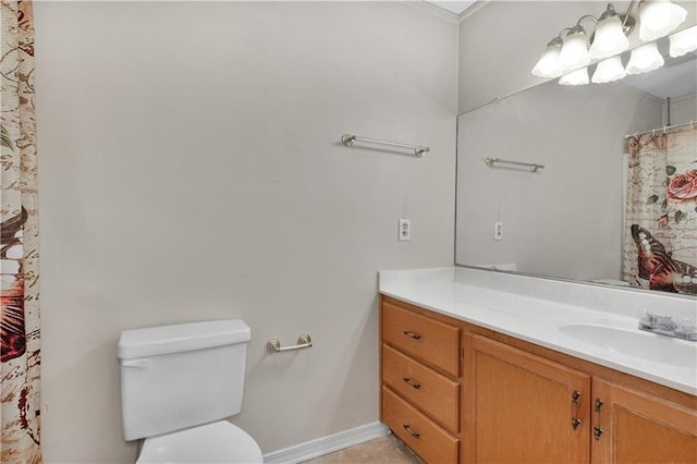 bathroom featuring toilet and vanity