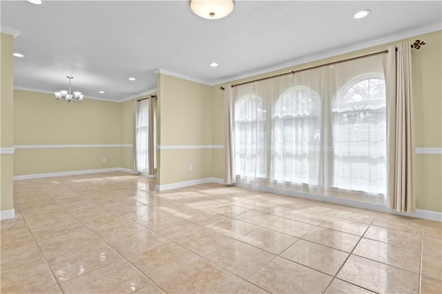 empty room featuring a chandelier and crown molding