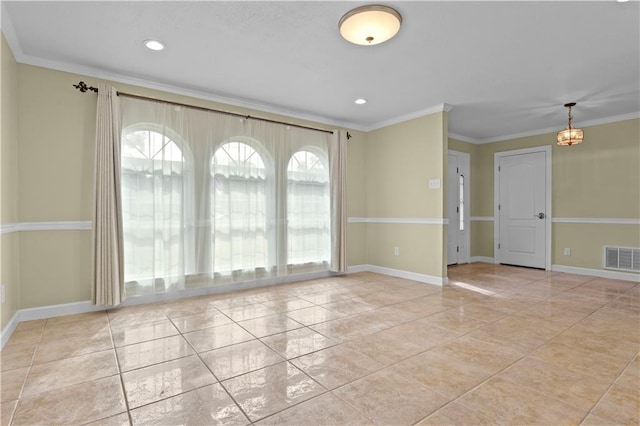 unfurnished room featuring light tile patterned floors and crown molding