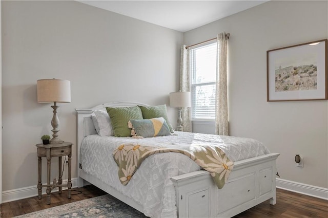 bedroom with dark wood-type flooring